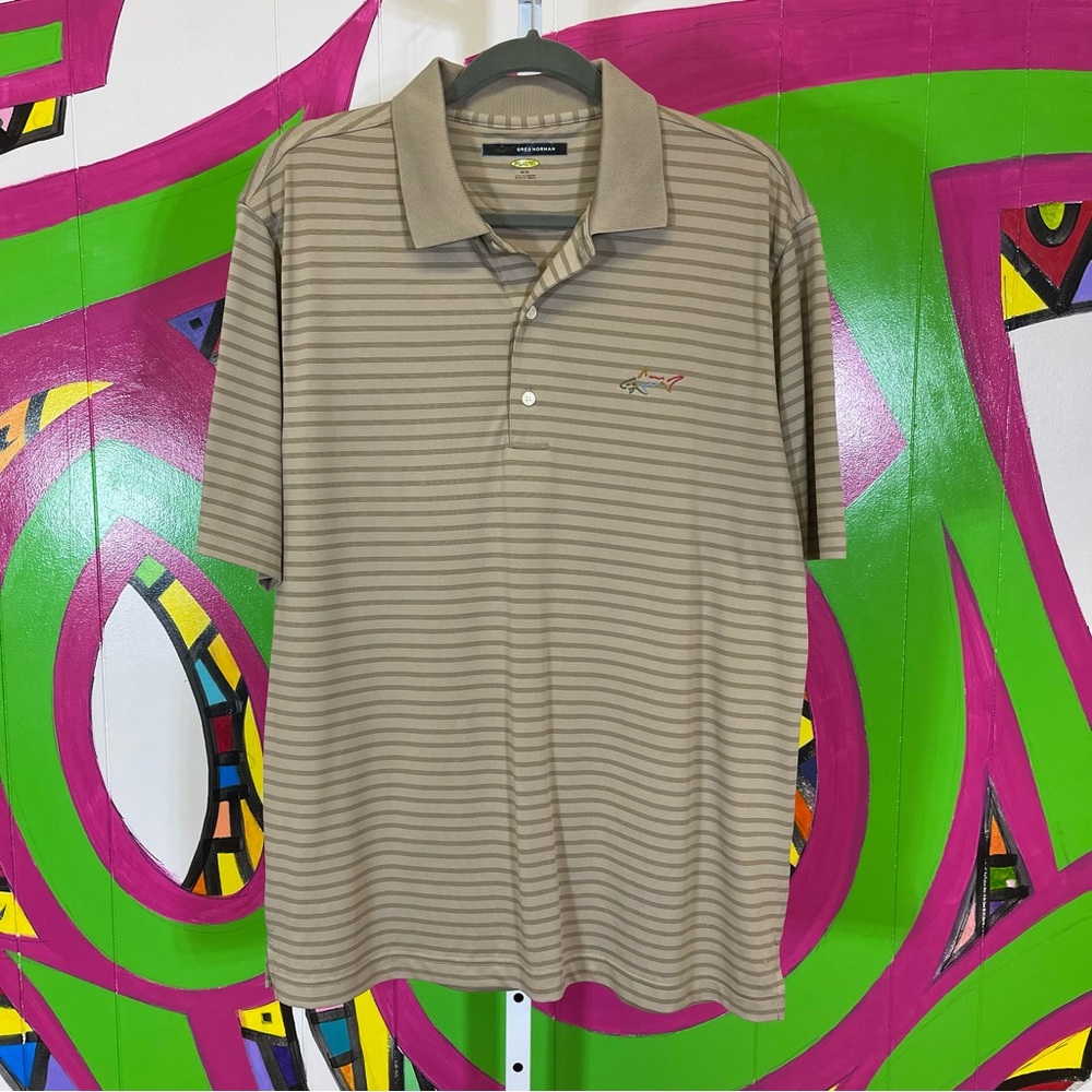 Greg Norman, Play Dry. Striped Polo. Size Medium. In excellent condition!